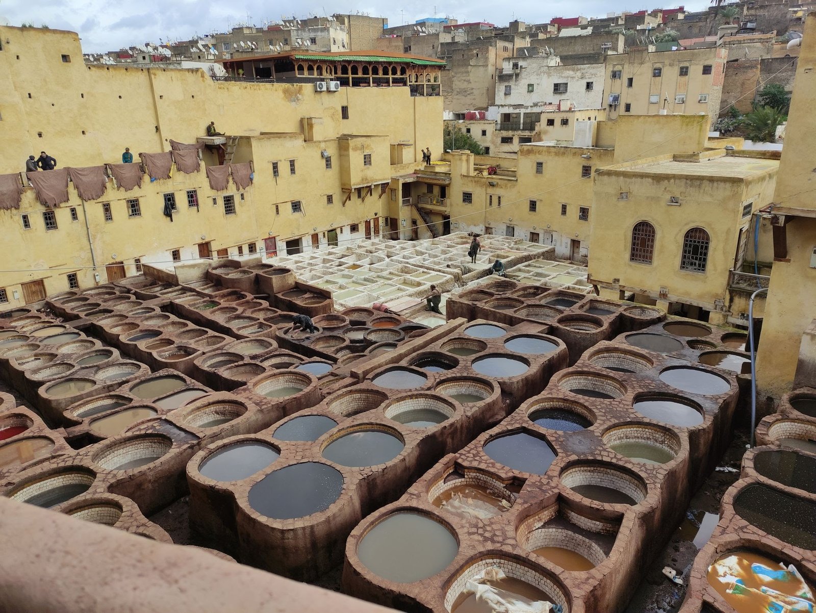 Dar Dbagh is a historical site located in the city of Fes, Morocco. It is a traditional Moroccan house, or "dar," that holds great cultural and architectural significance. The name "Dbagh" refers to the leather industry that once thrived in this area.
Dar Dbagh showcases the distinctive Moroccan architecture with its intricate designs, beautiful tilework, and ornate carvings. The house features a central courtyard, known as a "riad," which serves as a gathering space and provides natural light and ventilation to the surrounding rooms.
Inside Dar Dbagh, visitors can explore different rooms and chambers that reflect the rich heritage of Fes. These rooms often display traditional furniture, textiles, and handicrafts, giving visitors a glimpse into the daily lives of Moroccan families from the past.
One of the highlights of Dar Dbagh is its connection to the leather industry. In the past, the house served as a tannery, where animal hides were processed and transformed into leather goods. This historical aspect adds a unique dimension to the visit, providing insight into the traditional craftsmanship and industries of Fes.
Dar Dbagh is not only a testament to Fes' architectural heritage but also a cultural landmark that represents the city's history and traditions. It offers visitors an immersive experience into Moroccan culture, artistry, and craftsmanship, making it a must-visit attraction for those interested in exploring the cultural treasures of Fes.